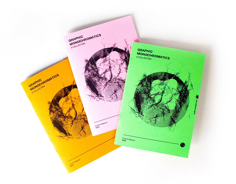 Three colorful booklets titled Graphic Monochromatics: A Collection are displayed on a white surface. They resemble a vibrant zine with punk-inspired energy, in orange, pink, and green, each featuring a bold geometric black illustration on the cover.